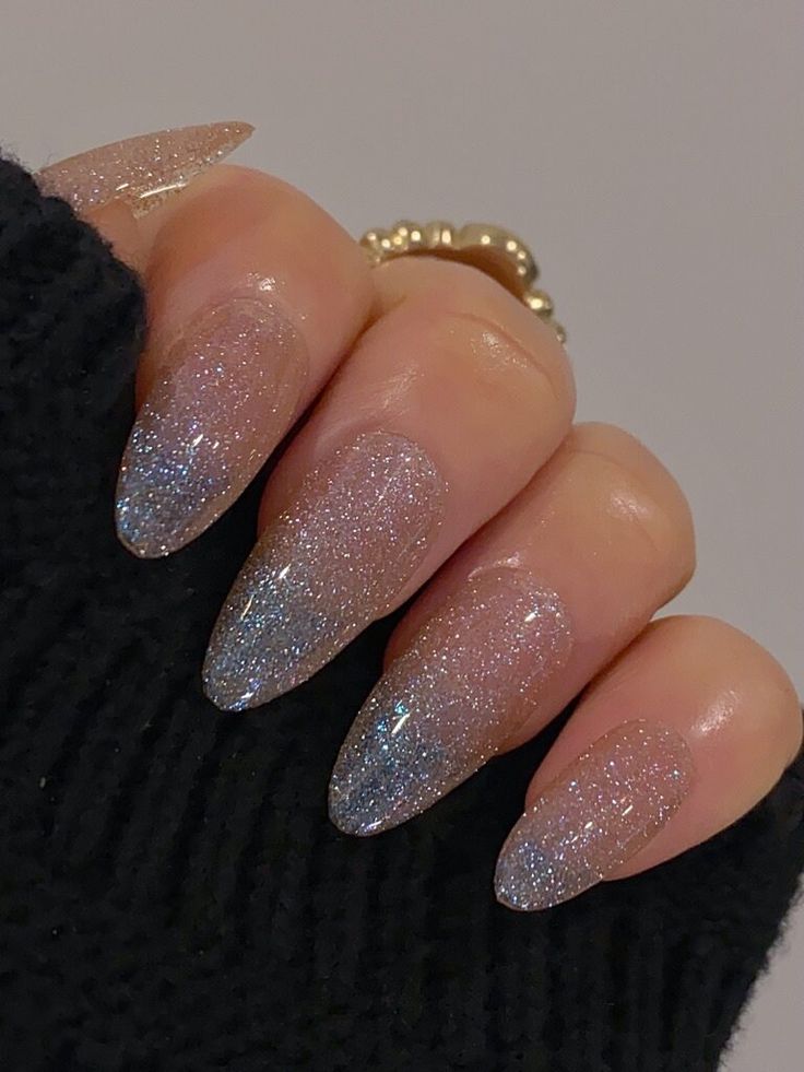 Elegant Almond-Shaped Nail Design with Sparkly Ombre Gradient