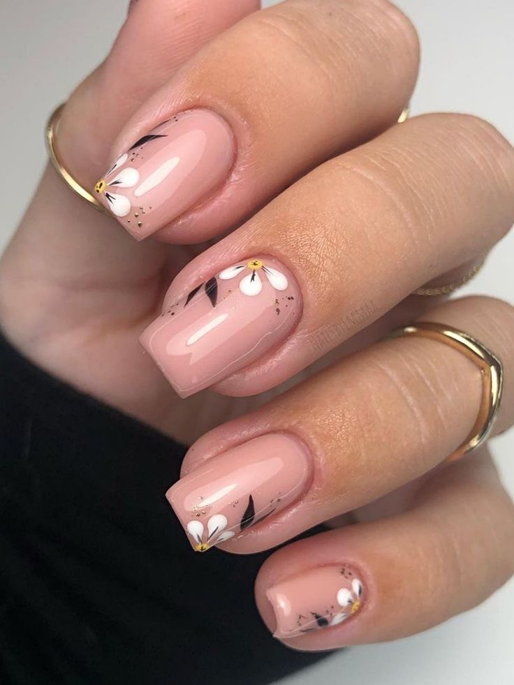 Elegant Floral Nail Design with Soft Pink Base and White Daisy Accents.