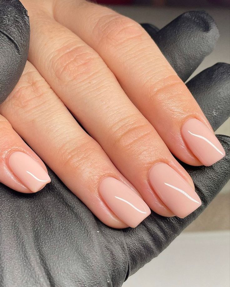 Elegant Sleek Nude Nails with Glossy Finish and Sophisticated White Edge Design.