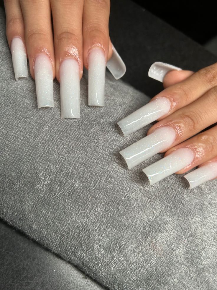 Elegant Ombre Acrylic Nails with Glitter Accents for a Sophisticated Look.