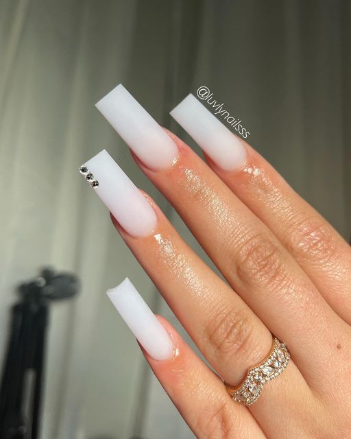 Elegant Ombre White Nails with Rhinestone Accents for a Chic Look