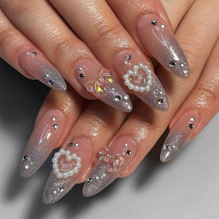 Elegant Ombre Acrylic Nails with Rhinestones and 3D Embellishments for a Glamorous Look.