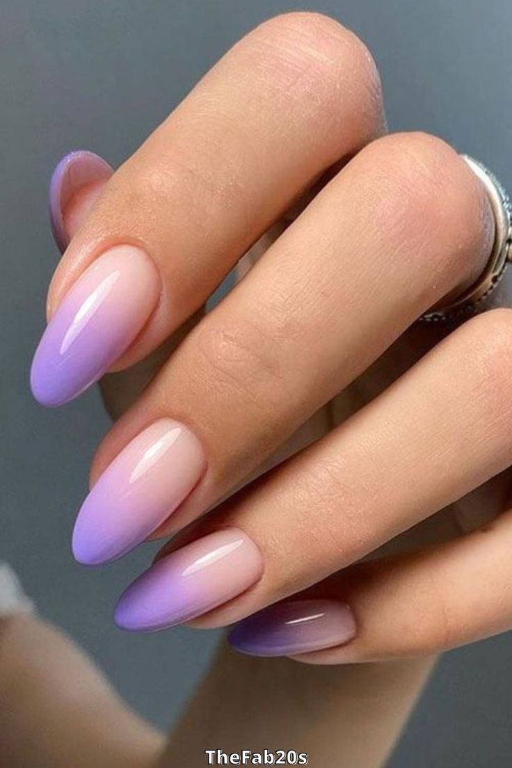 Elegant Ombre Nail Design: Soft Lilac to Clear with Almond Shape for a Modern Touch.