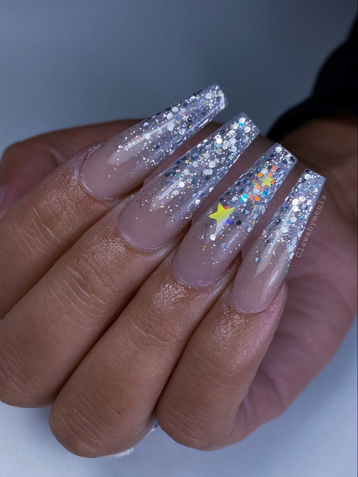 Elegant Almond-Shaped Nails with Dazzling Glitter and Whimsical Star Accents