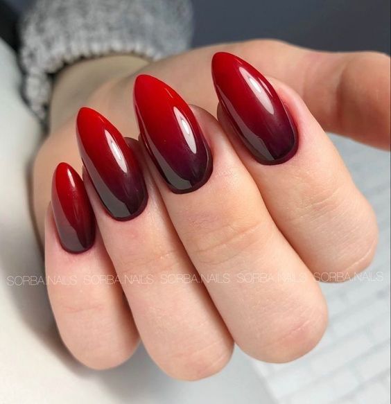 Elegant Ombre Nail Design: Dramatic Deep Red and Black with Glossy Finish.