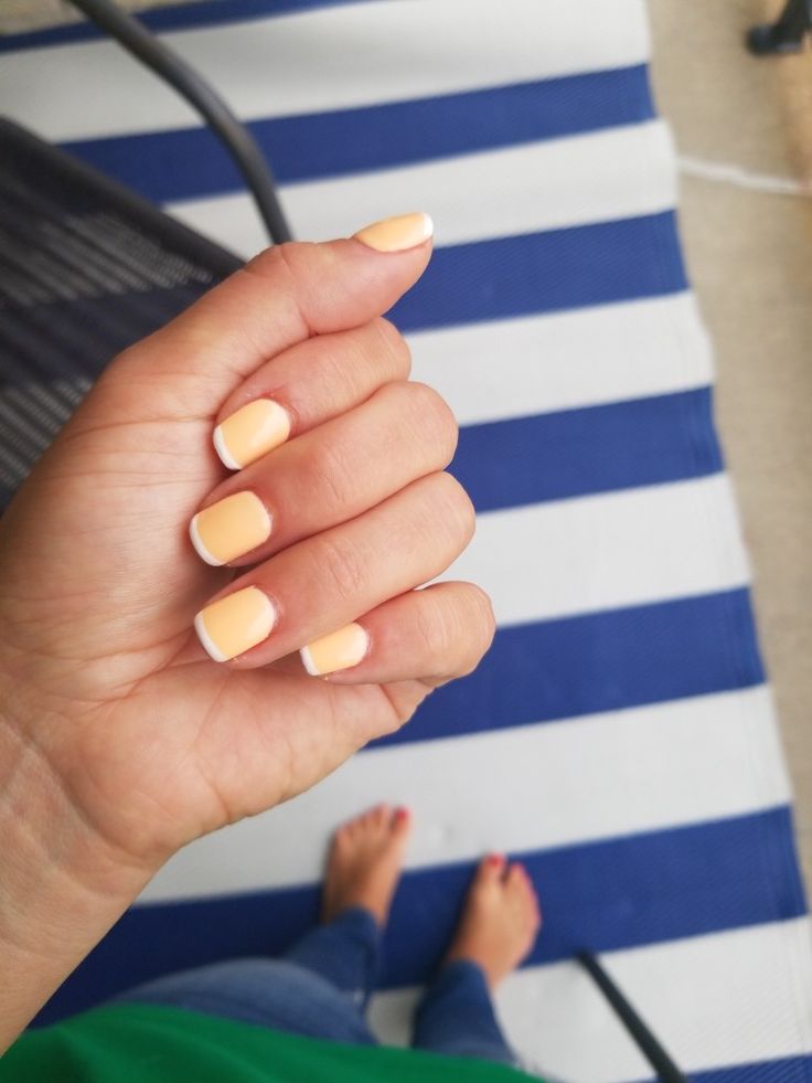 Cheerful Bright Yellow French Tip Manicure: A Fresh Summer Nail Art Look.