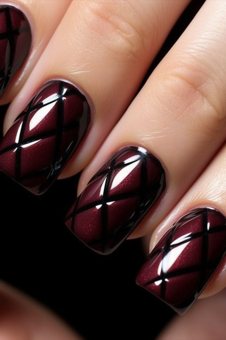 Sophisticated Deep Burgundy and Glossy Black Crisscross Nail Design for Versatile Elegance.