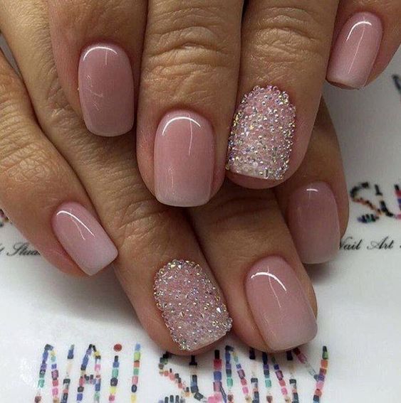 Sophisticated Elegant Nude Manicure with Glitter Accent for Any Occasion