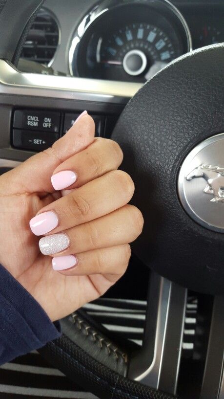 Sophisticated Soft Pink Nail Design with Sparkling Accents.