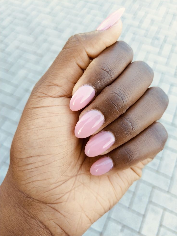 Sophisticated Soft Pink Almond Nails: A Versatile Elegance for Any Occasion.