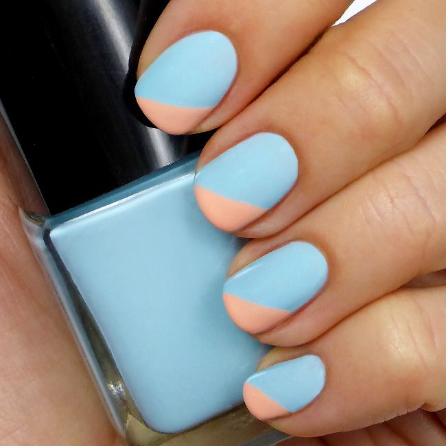 Chic Geometric Nail Design: Soft Blue Base with Pastel Peach Accents and Modern Diagonal Division.