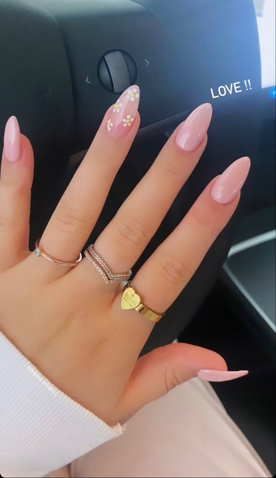 Chic Almond Pink Nails with Floral Accent for Effortless Elegance.