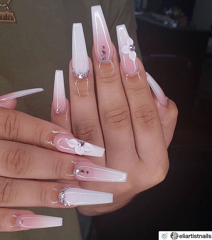 Sophisticated Long Square Nail Design with Soft Pink and White Shades, Intricate Floral Details, and Shimmering Gems.