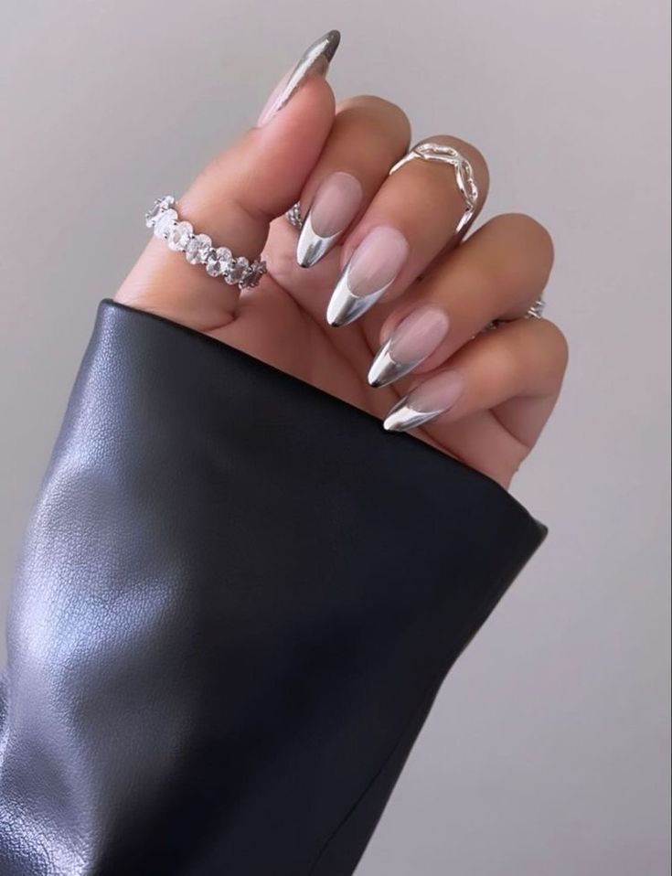 Sophisticated Metallic Silver-Tipped Nude Stiletto Nails for Fashion-Forward Elegance.