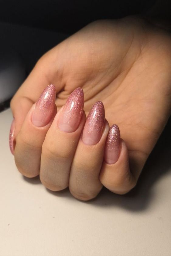 Elegant Glistening Ombre Nails with Sparkling Pink Gradient for Any Occasion.