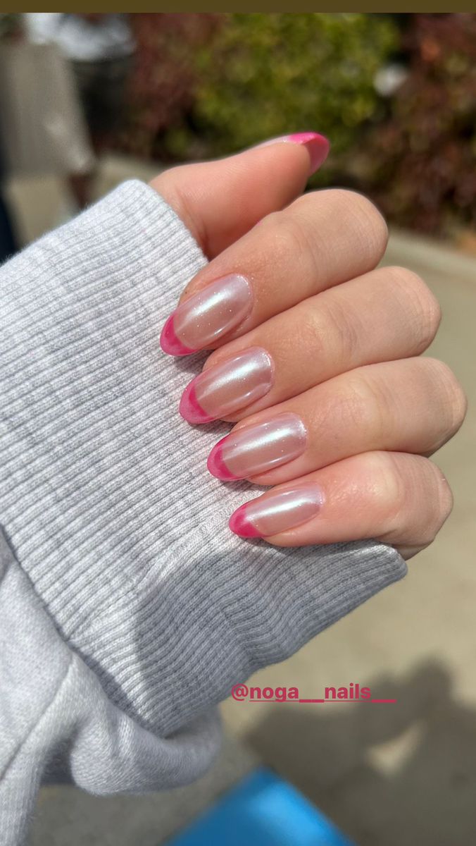 Translucent Base with Bold Pink French Tips for a Modern, Elegant Nail Design.