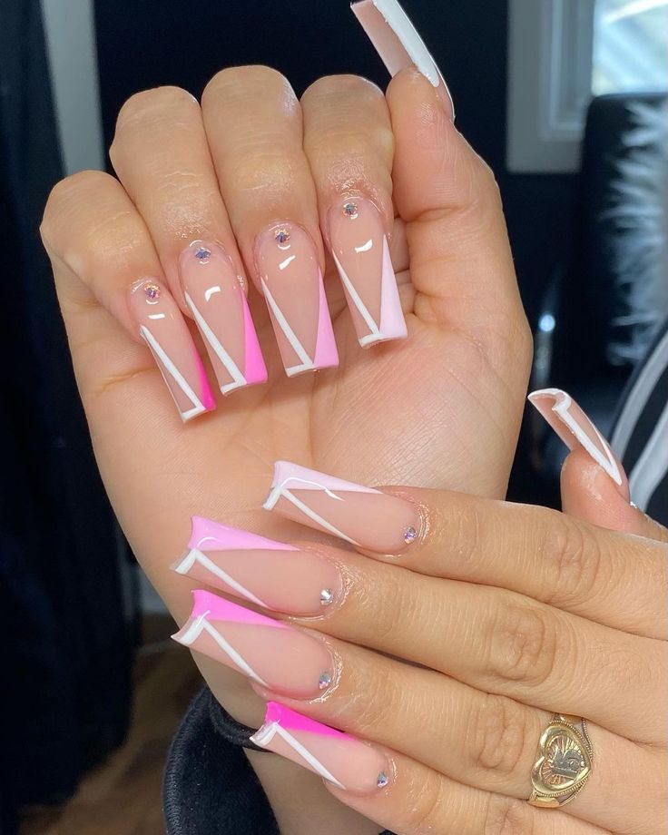 Chic Pink and White Nail Design with Geometric Accents and Crystals