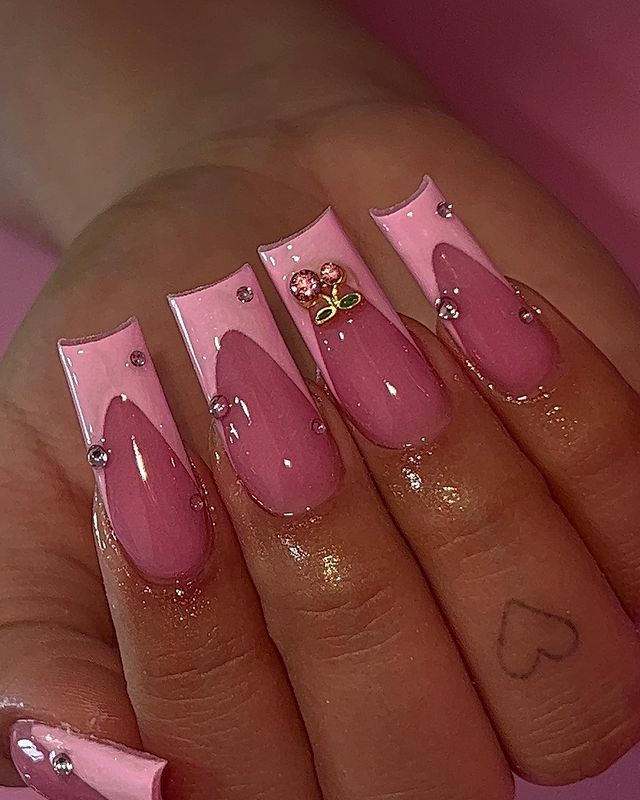 Chic Pink Nail Design with Matte and Glossy Finishes, Elegant Details, and Floral Embellishments.