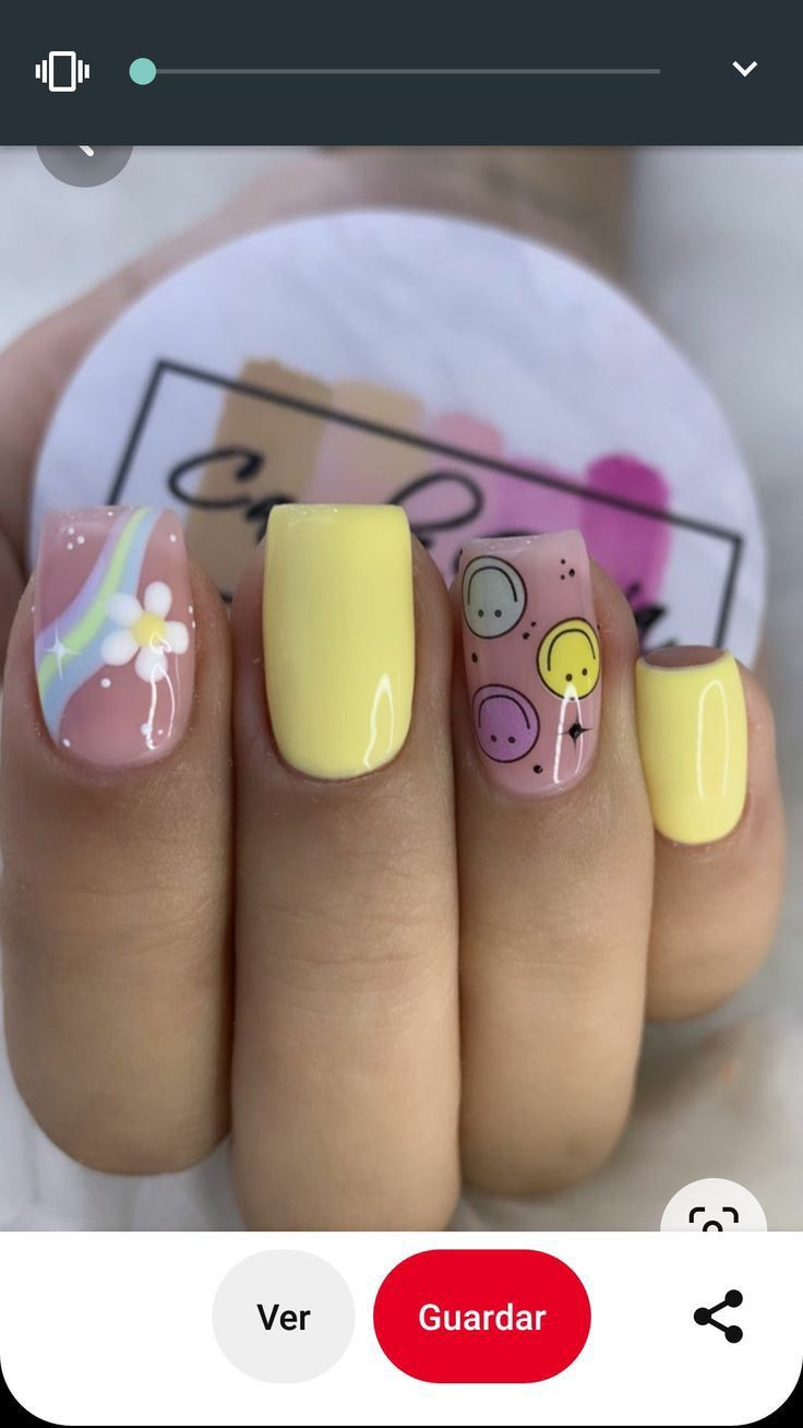 Playful Pastel Nail Design with Whimsical Patterns for a Cheerful Aesthetic.