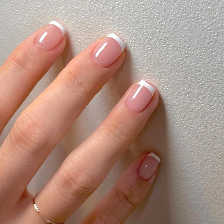 Timeless Elegant French Manicure: Soft Pink Base with Crisp White Tips for Any Occasion.