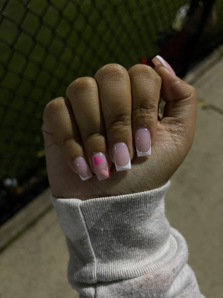 Elegant Soft Pink and French Tip Nail Design with Modern Geometric Accent.