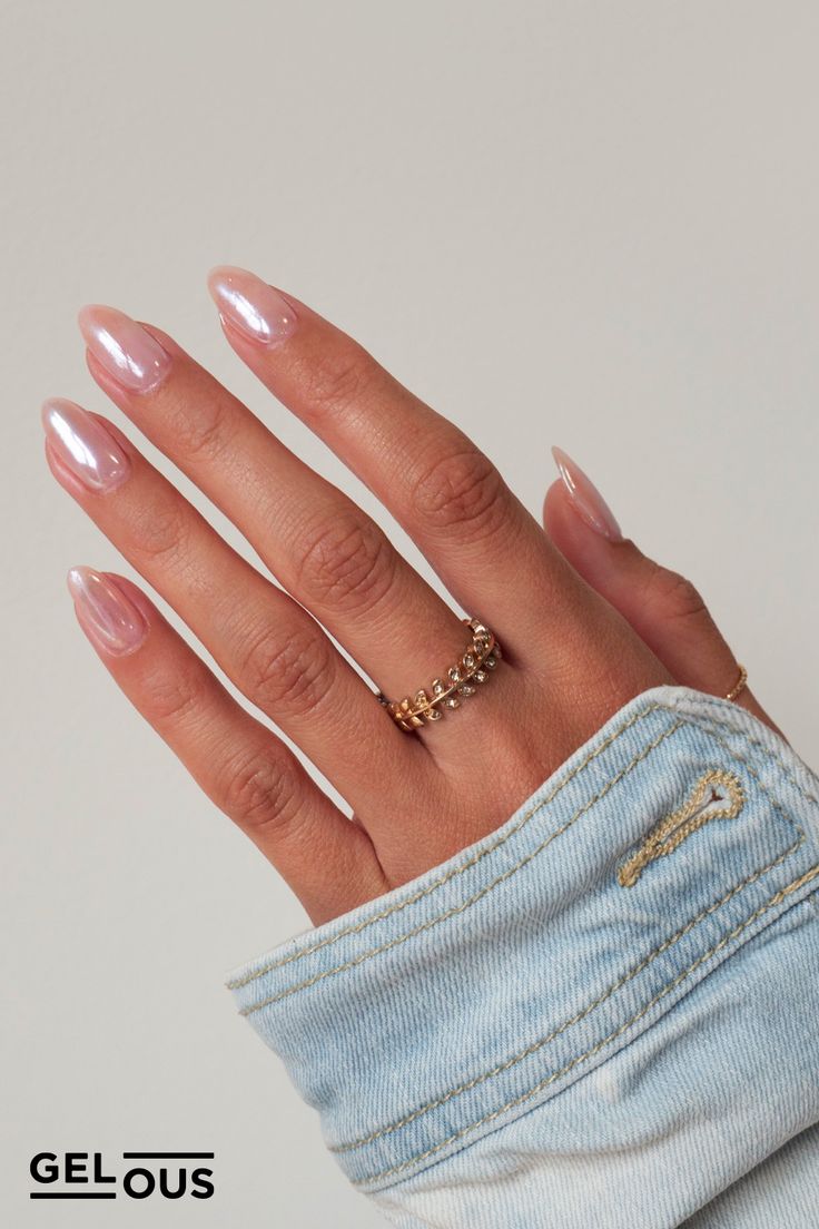 Elegant Glossy Nude Nails with Pointed Shape and Minimalist Gold Rings for Any Occasion