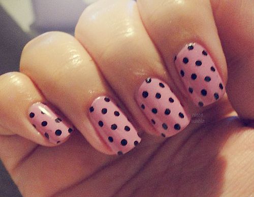 Whimsical Soft Pink and Bold Black Polka Dot Nail Design for Any Occasion