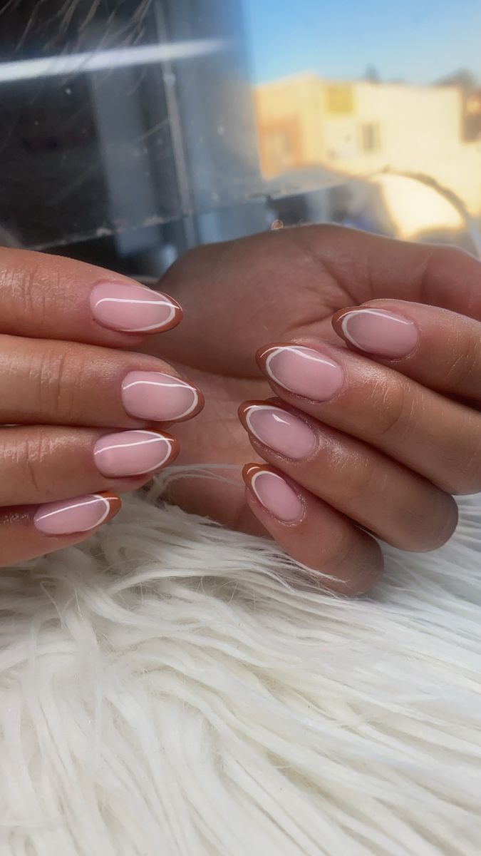 Elegant Modern Twist on Classic French Manicure with Soft Pink and Delicate Outline.