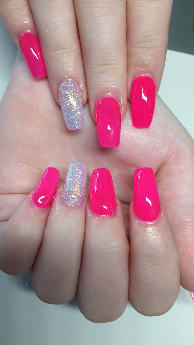 Playful Pink and Glittery Manicure: A Bold and Whimsical Nail Design.