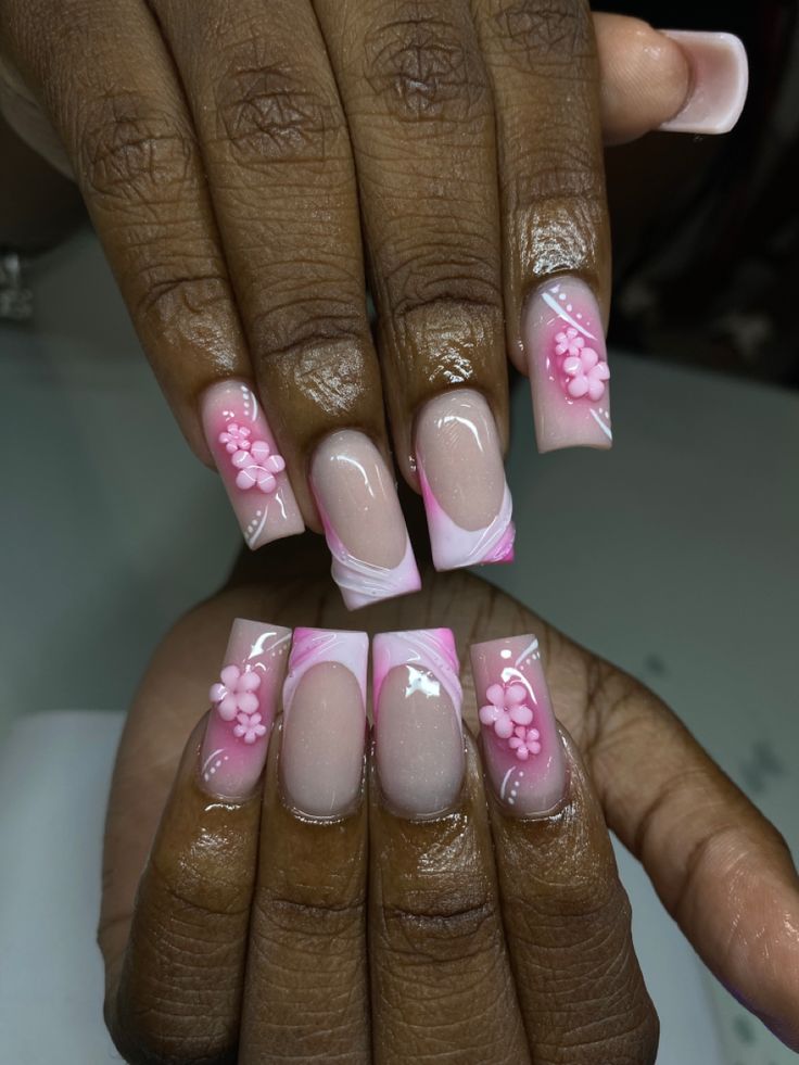 Sophisticated Soft Pink Floral Nail Design with Artistic White Marbling.