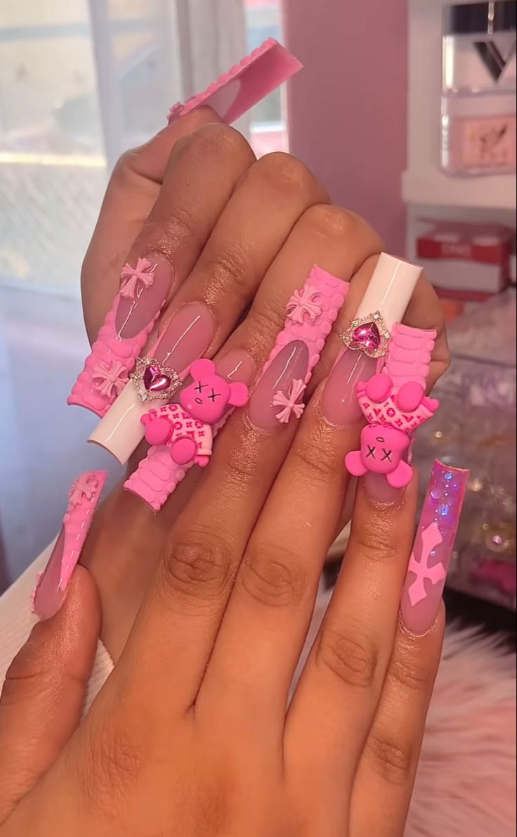 Whimsical Pink Nail Design with Playful Embellishments and Textured Finishes