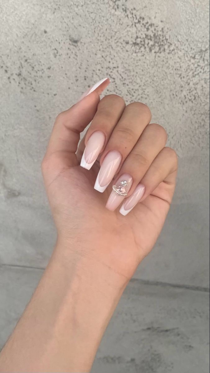 Chic Almond-Shaped French Manicure with Rhinestone Accent Nail.