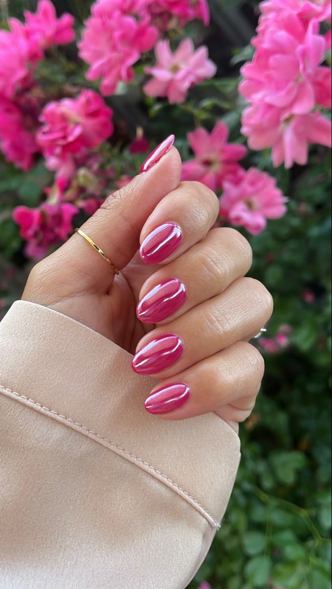 Chic Almond-Shaped Nails with Glossy Pink and Metallic Stripes on a Floral Background.