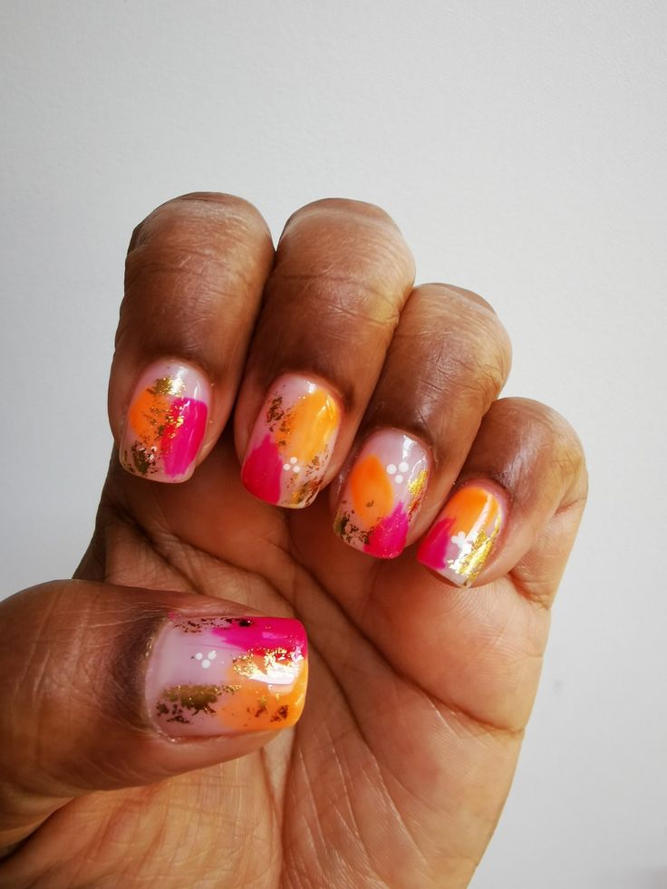 Vibrant Summer Nail Design with Abstract Patterns and Elegant Gold Accents.