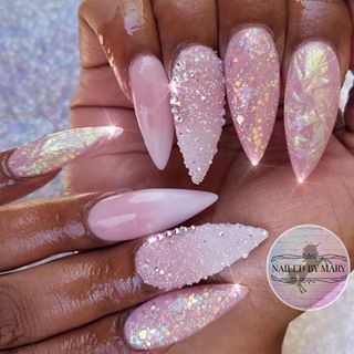 Chic Soft Pink Nail Design with Shimmering Accents and Glitter.