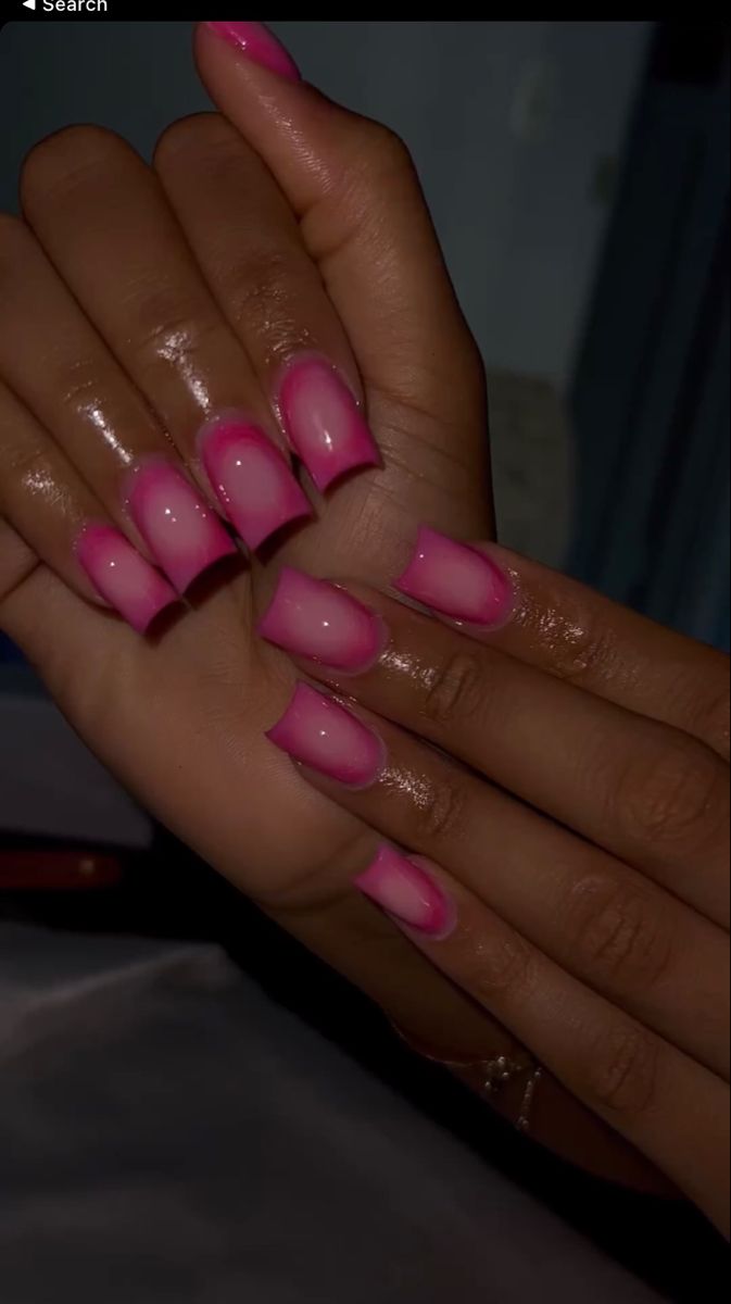 Chic Ombre Pink Nails with Glossy Finish and Elegant Elongated Shape.