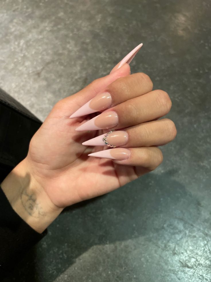 Sophisticated Stiletto Nails with Soft Pink Gradient and Sparkling Embellishments