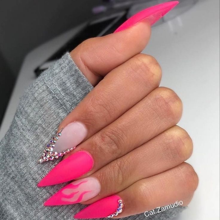 Bold Pink Stiletto Nails Featuring Gradient Flames and Rhinestone Accents.