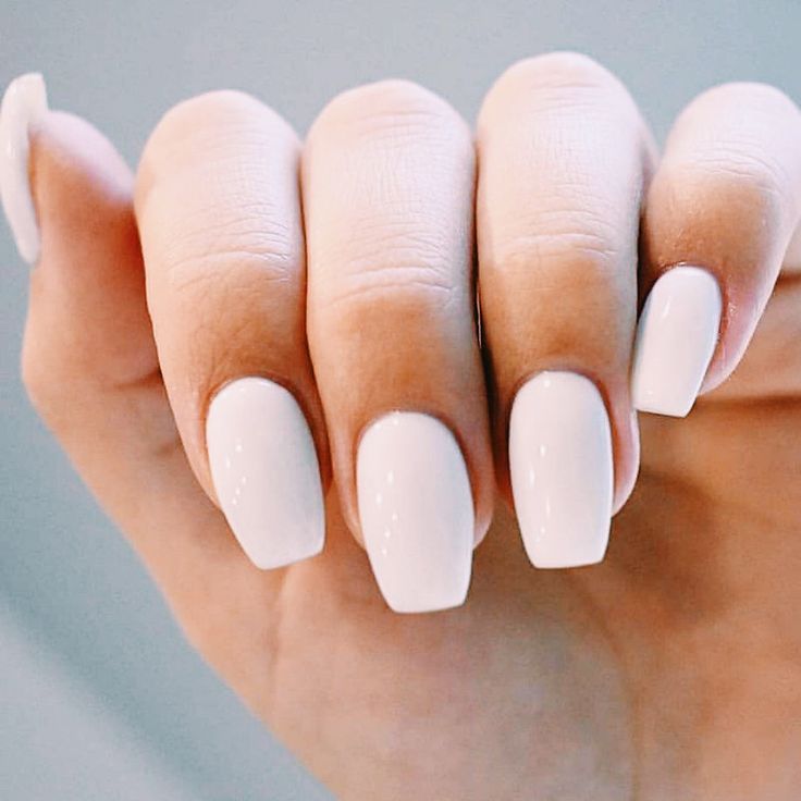 Chic Minimalist Nail Design: Elegant Solid White Polish for Every Occasion.