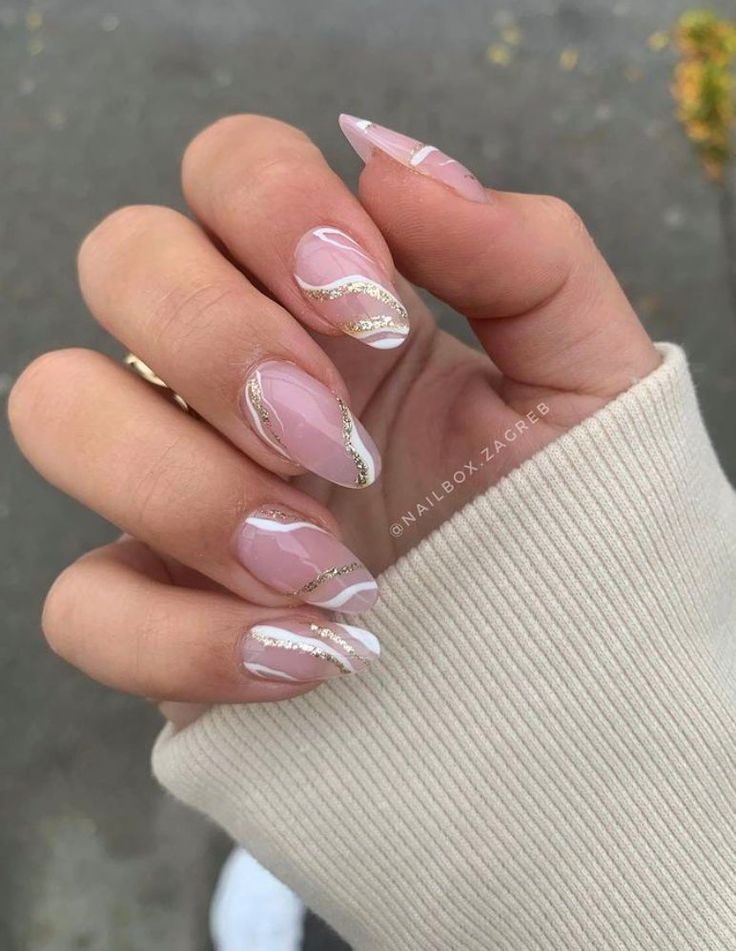 Sophisticated Soft Pink Nail Design with Glossy Finish and Elegant White and Gold Accents.