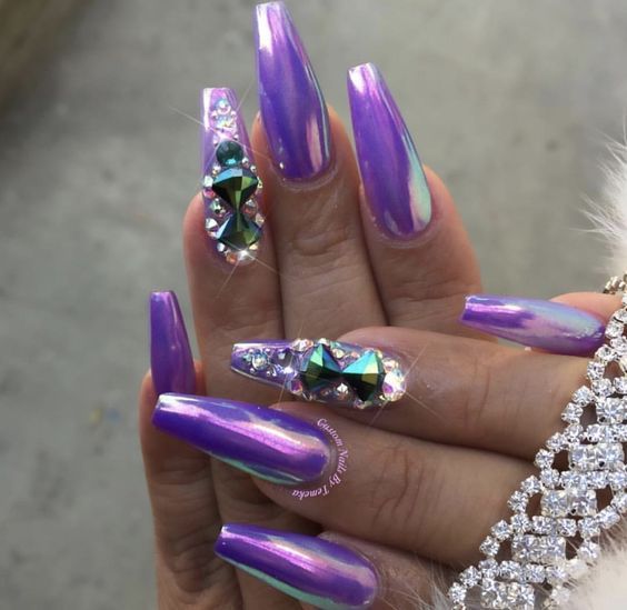 Bold Iridescent Purple Nails Accented with Glamorous Rhinestones.