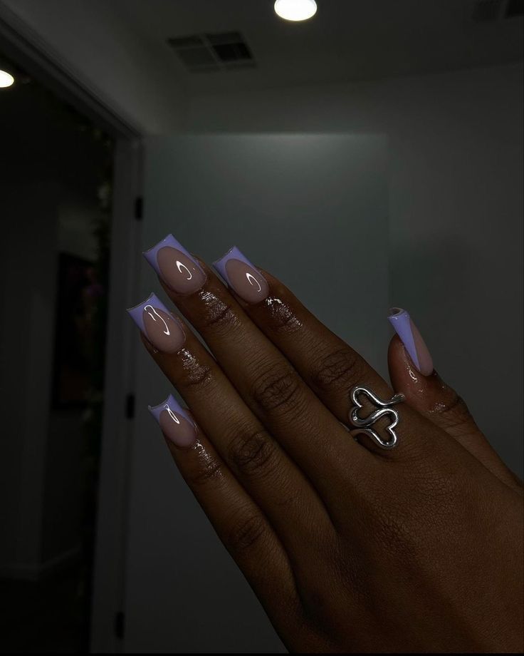 Trendy Square Nail Design with Pastel Purple Tips and Glossy Nude Base.