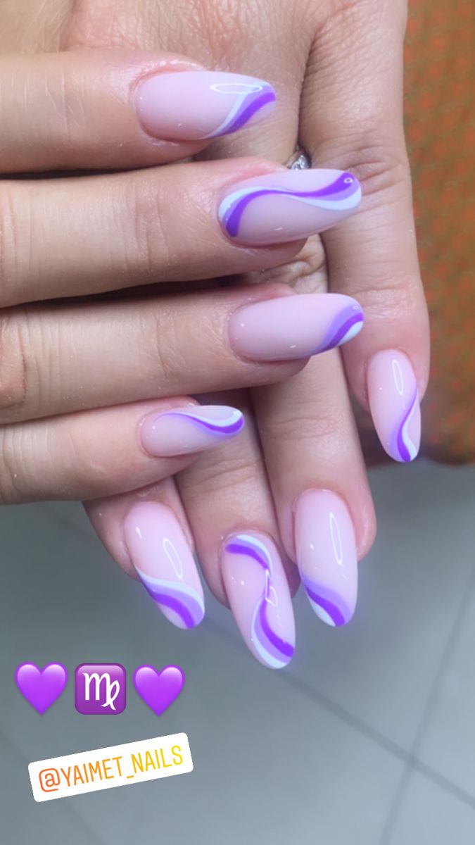 Sophisticated Nail Art: Soft Nude Base with Artistic Purple and White Wave Designs.