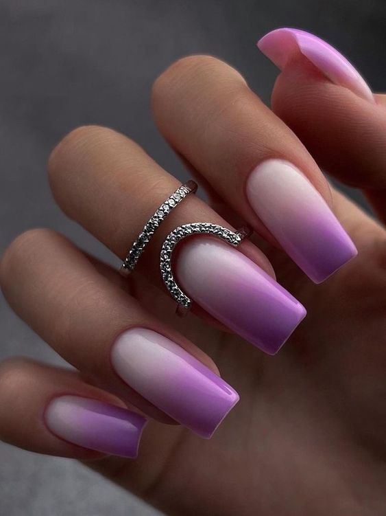 Elegant Gradient Nail Design: Soft Pink and Lilac with Glossy Finish and Silver Rings.