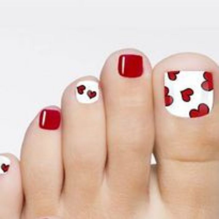 Cheerful Red and White Heart-Themed Toenail Design for Special Occasions.