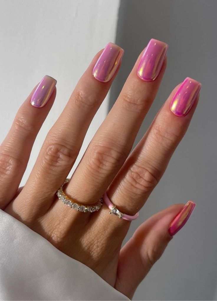 Chic Gradient Nail Design in Soft Pink and Light Purple with Iridescent Accents and Complementary Rings.