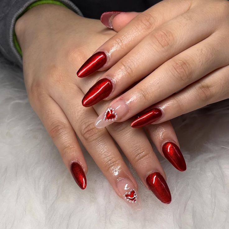 Elegant Glossy Red Nail Design with Accent Heart for a Festive Modern Twist.