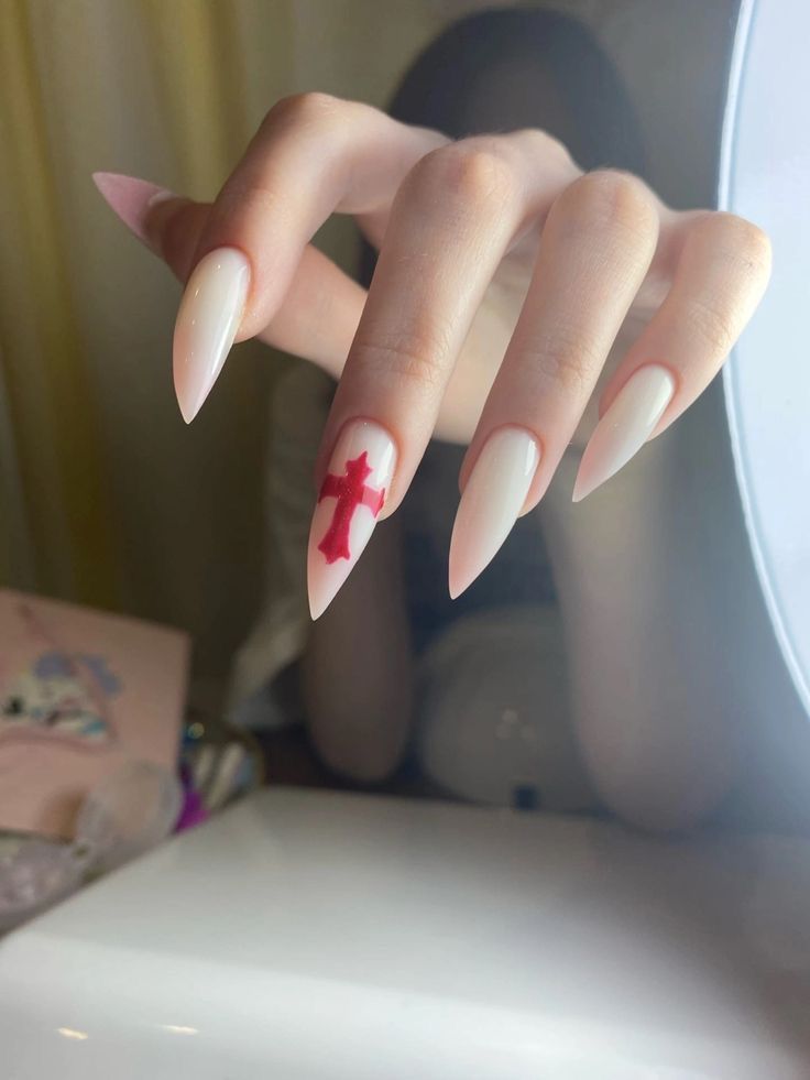 Sophisticated Almond-Shaped Nails Featuring a Bold Red Cross Design