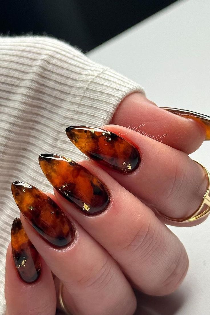 Elegant Tortoiseshell Nail Design with Gold Accents for a Bold Statement.