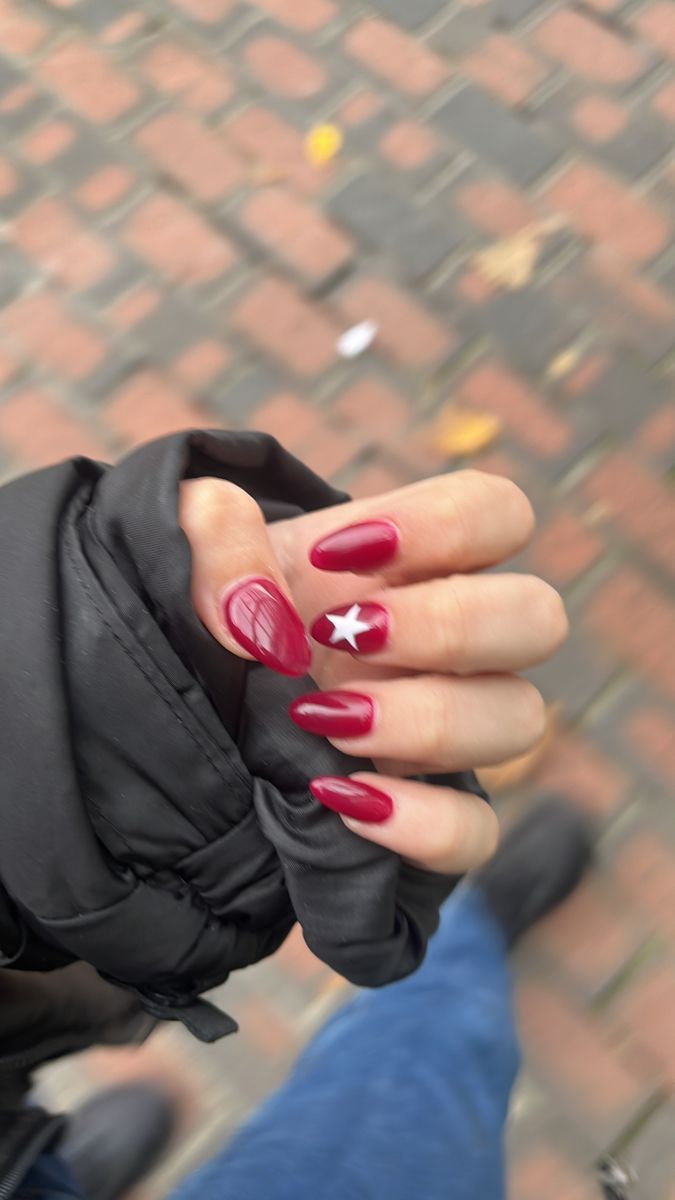 Chic Deep Red Nail Design with Glossy Finish and Creative Accents